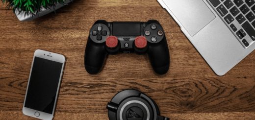 Black Game Controller on Wooden Surface / Photo by Garrett Morrow from Pexels
