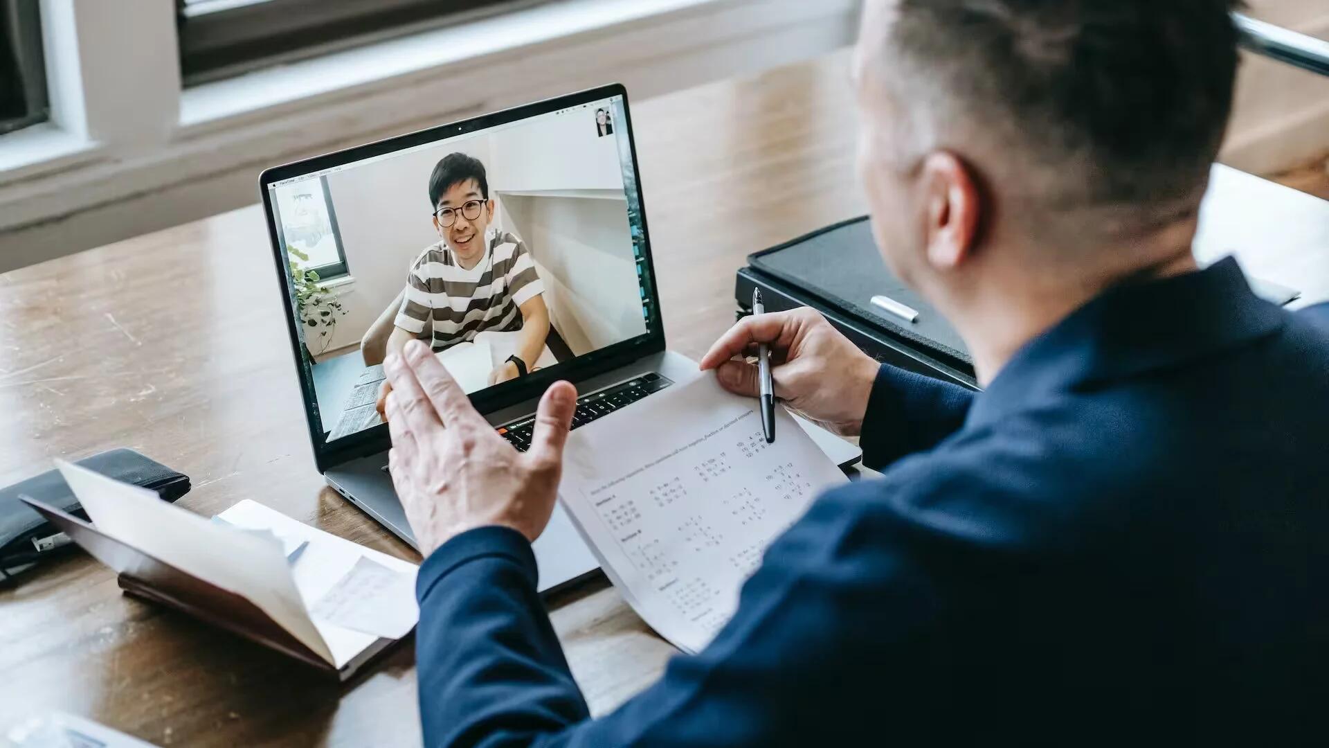 Professor teaching his student online