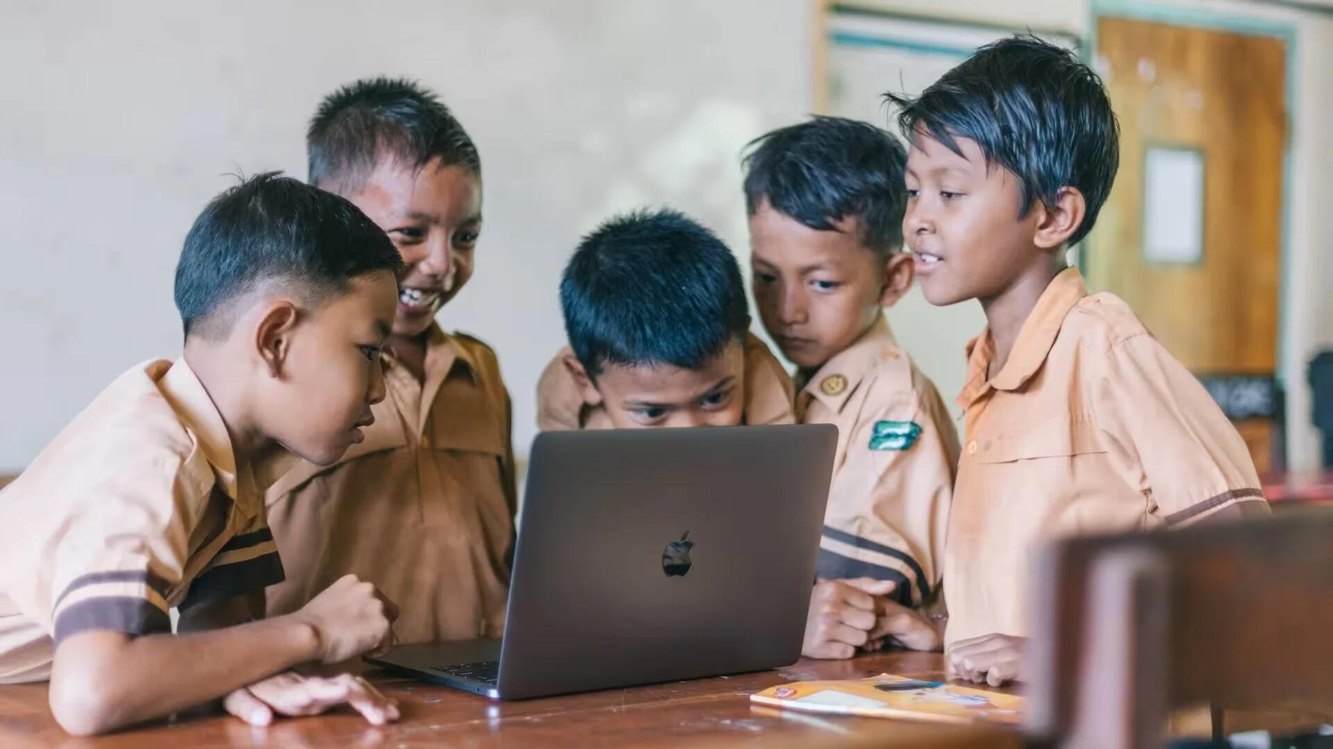 Students Looking At Macbook